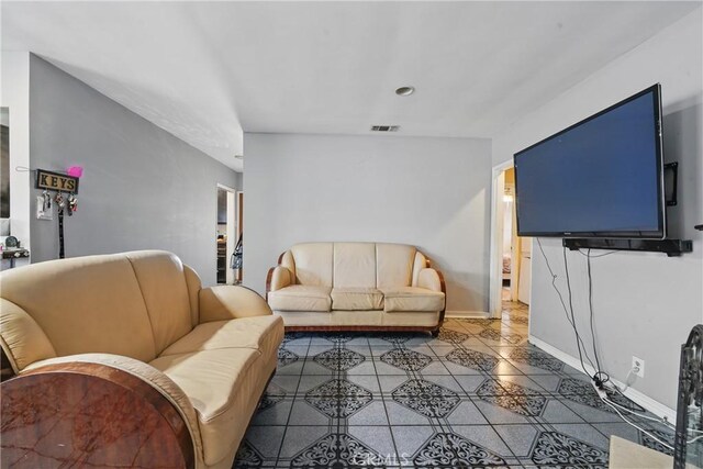 14276 Aztec St, Sylmar, CA 91342 - living area featuring tile patterned flooring and baseboards