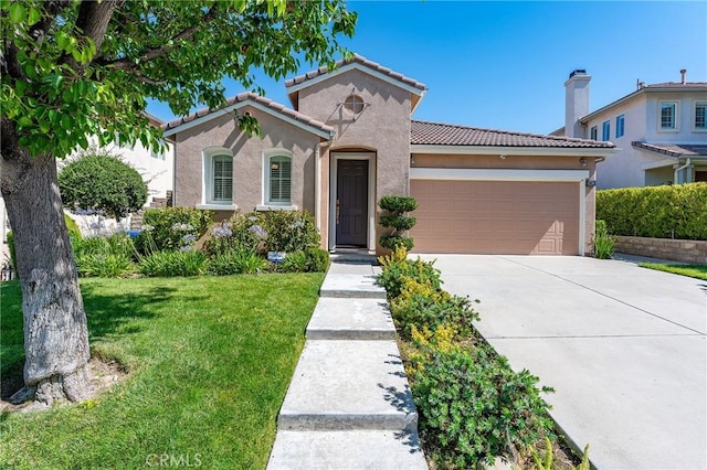 19613 Edmonds Pl, Saugus, CA 91350 - mediterranean / spanish house with a garage, concrete driveway, a front lawn, stucco siding, and a tiled roof
