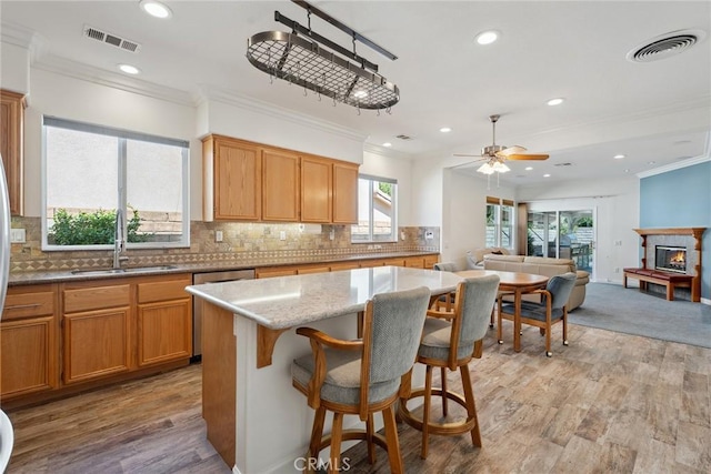 19613 Edmonds Pl, Saugus, CA 91350 - kitchen featuring ornamental molding, light wood-type flooring, ceiling fan, recessed lighting, and decorative backsplash