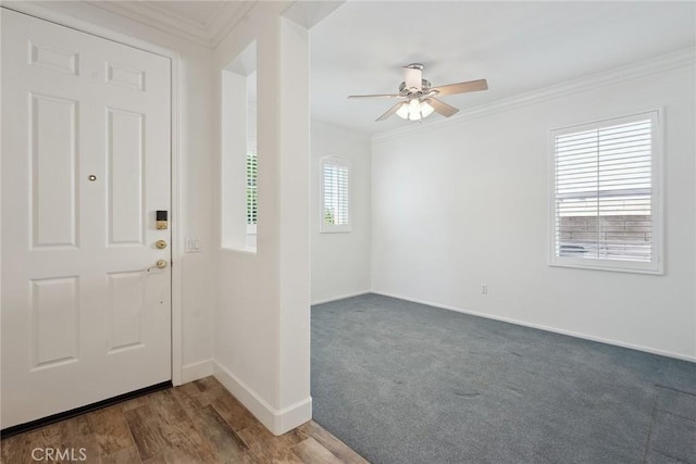 19613 Edmonds Pl, Saugus, CA 91350 - foyer entrance with ornamental molding, ceiling fan, and dark colored carpet