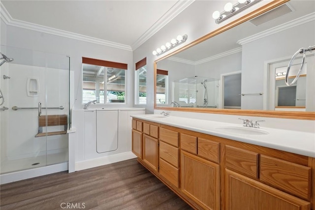 19613 Edmonds Pl, Saugus, CA 91350 - full bath with a stall shower, wood finished floors, double vanity, a bath, and crown molding