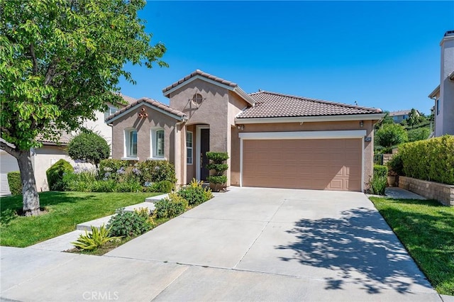 19613 Edmonds Pl, Saugus, CA 91350 - mediterranean / spanish home featuring a garage, concrete driveway, a front lawn, a tile roof, and stucco siding