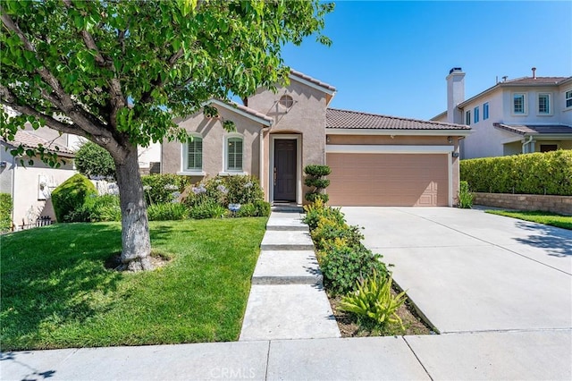 19613 Edmonds Pl, Saugus, CA 91350 - mediterranean / spanish-style home with an attached garage, driveway, stucco siding, a tiled roof, and a front yard