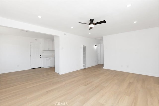 55650 Navajo Trl, Yucca Valley, CA 92284 - spare room with a heating unit, a ceiling fan, light wood-style flooring, recessed lighting, and baseboards
