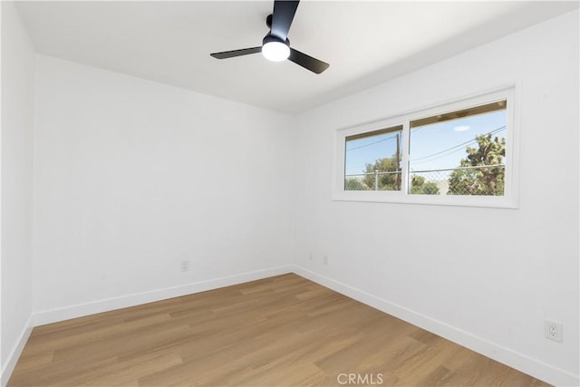55650 Navajo Trl, Yucca Valley, CA 92284 - empty room featuring light wood finished floors, baseboards, and a ceiling fan
