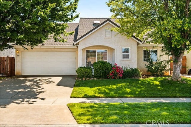 1105 Admiral Ln, Chico, CA 95926 - view of front of property with stucco siding, a garage, driveway, and roof with shingles