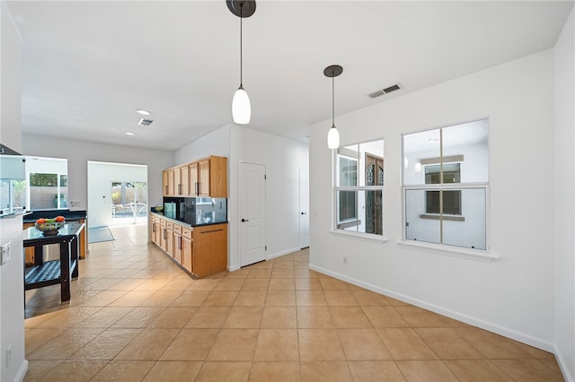 29083 Bent Tree Dr, Murrieta, CA 92563 - kitchen featuring hanging light fixtures, baseboards, dark countertops, and backsplash