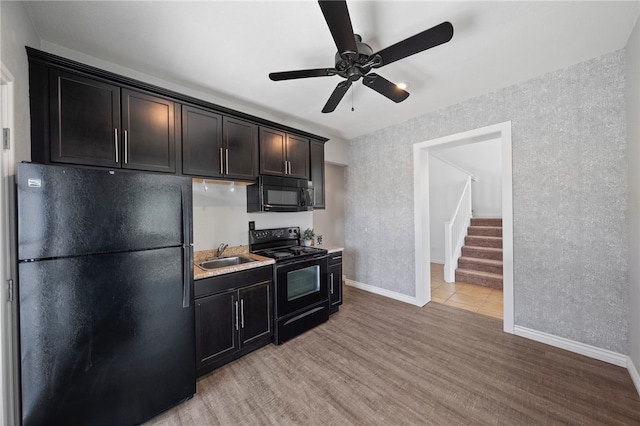 29083 Bent Tree Dr, Murrieta, CA 92563 - kitchen featuring black appliances, a sink, light wood-style floors, a ceiling fan, and a textured wall