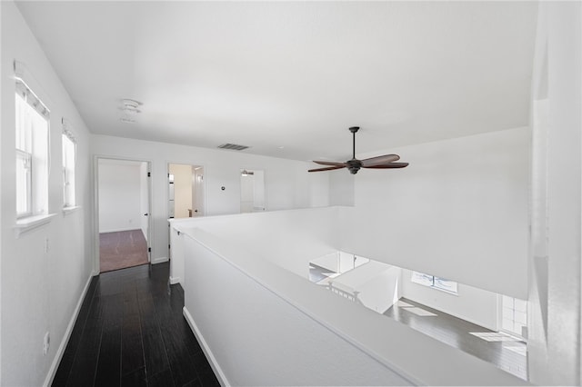 29083 Bent Tree Dr, Murrieta, CA 92563 - hallway with baseboards, an upstairs landing, and dark wood finished floors