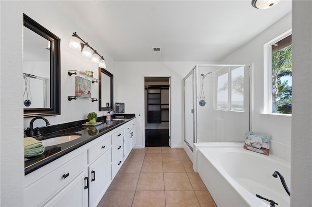 29083 Bent Tree Dr, Murrieta, CA 92563 - full bath with double vanity, a shower stall, a garden tub, and tile patterned floors