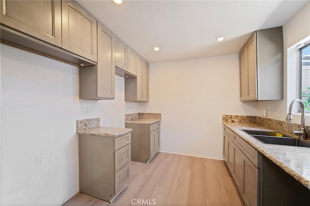 1926 Lucas St Unit 2, San Fernando, CA 91340 - kitchen with a sink, light wood-style flooring, recessed lighting, and light stone counters
