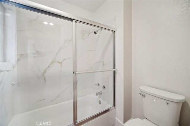 1926 Lucas St Unit 2, San Fernando, CA 91340 - bathroom featuring toilet and bath / shower combo with glass door