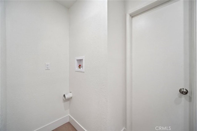 1926 Lucas St Unit 2, San Fernando, CA 91340 - washroom featuring washer hookup, baseboards, and wood finished floors