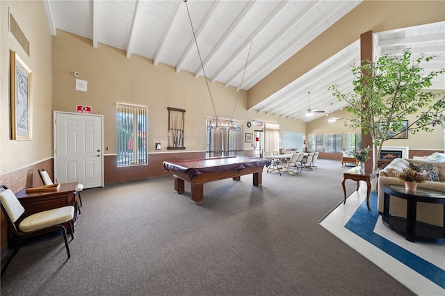43195 Andrade Ave Unit L, Hemet, CA 92544 - recreation room with carpet, beamed ceiling, high vaulted ceiling, billiards table, and a warm lit fireplace
