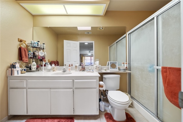 43195 Andrade Ave Unit L, Hemet, CA 92544 - full bath with toilet, vanity, a shower stall, and tile patterned floors