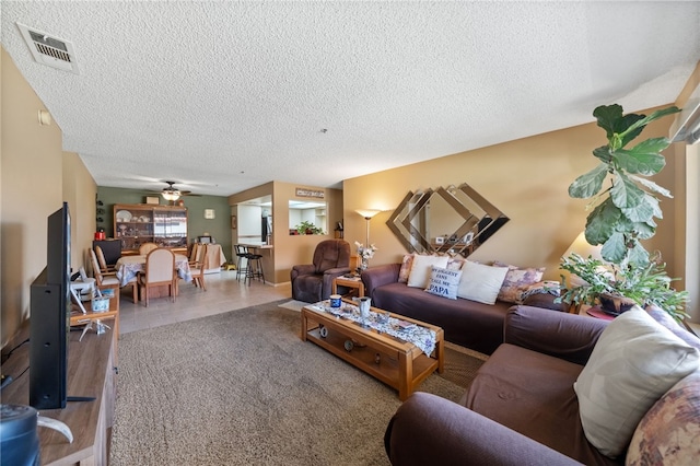 43195 Andrade Ave Unit L, Hemet, CA 92544 - living room with a textured ceiling, ceiling fan, and wood finished floors