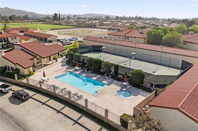 43195 Andrade Ave Unit L, Hemet, CA 92544 - aerial perspective of suburban area featuring a pool area and a mountainous background