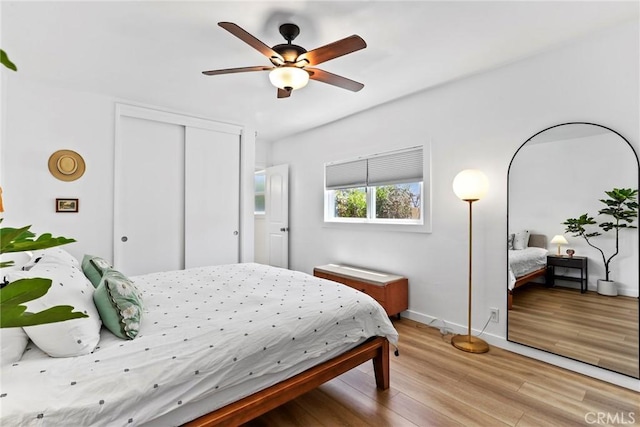 1156 W 26th St, San Pedro, CA 90731 - bedroom featuring light wood-style flooring, a closet, baseboards, and a ceiling fan