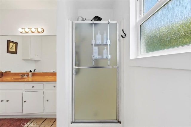 1156 W 26th St, San Pedro, CA 90731 - full bathroom featuring a stall shower, vanity, and tile patterned floors