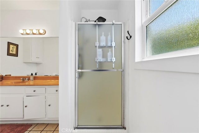 1156 W 26th St, San Pedro, CA 90731 - bathroom featuring a stall shower, vanity, and tile patterned flooring