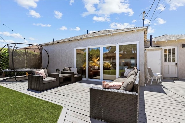 1156 W 26th St, San Pedro, CA 90731 - wooden deck featuring a trampoline, an outdoor living space, and a lawn