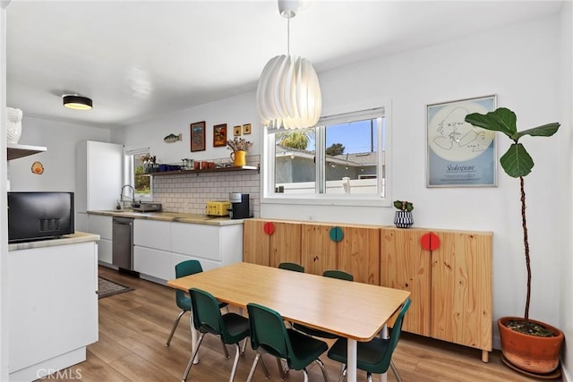 1156 W 26th St, San Pedro, CA 90731 - dining space with plenty of natural light and light wood finished floors