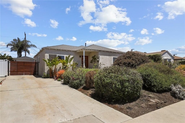 1156 W 26th St, San Pedro, CA 90731 - view of front of property featuring a gate, stucco siding, and concrete driveway