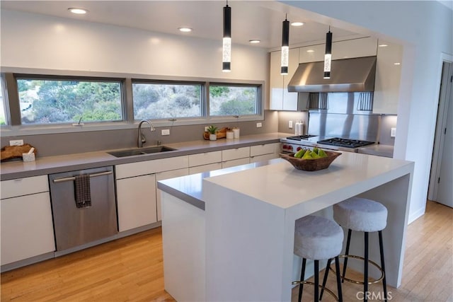 901 Summit Dr, Laguna Beach, CA 92651 - kitchen featuring stainless steel dishwasher, white cabinets, a sink, wall chimney exhaust hood, and recessed lighting