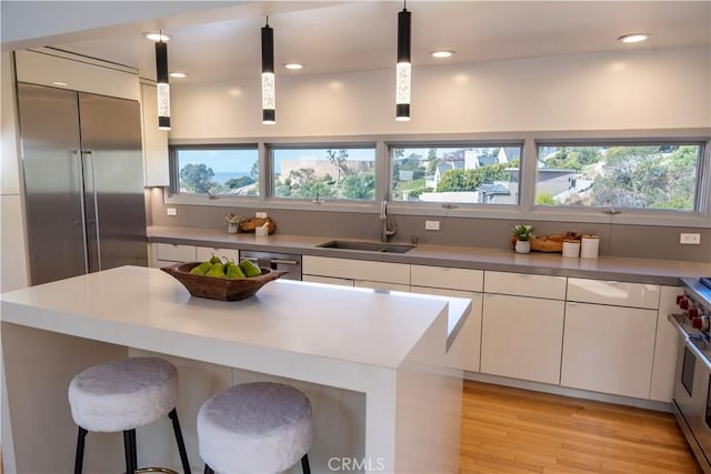901 Summit Dr, Laguna Beach, CA 92651 - kitchen featuring a sink, plenty of natural light, white cabinetry, and recessed lighting