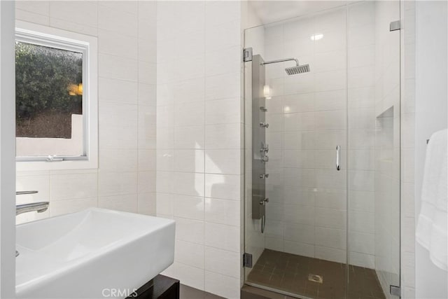901 Summit Dr, Laguna Beach, CA 92651 - bathroom featuring a stall shower, a sink, and tile walls