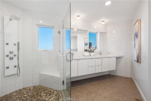 901 Summit Dr, Laguna Beach, CA 92651 - full bath featuring a shower stall, double vanity, tile patterned floors, recessed lighting, and tile walls