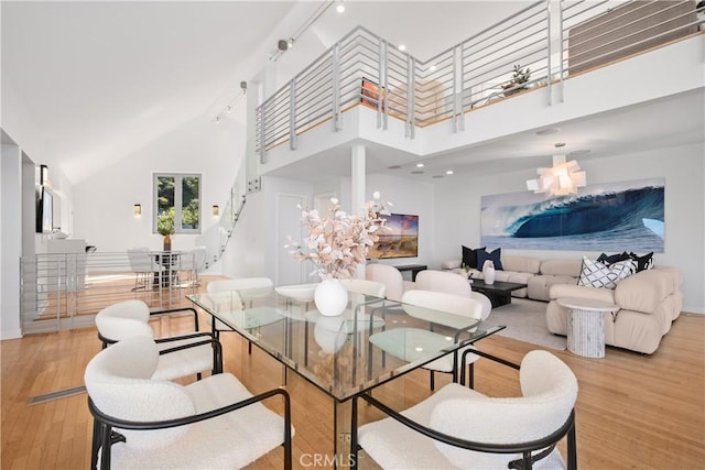 901 Summit Dr, Laguna Beach, CA 92651 - dining room with high vaulted ceiling, wood finished floors, and baseboards