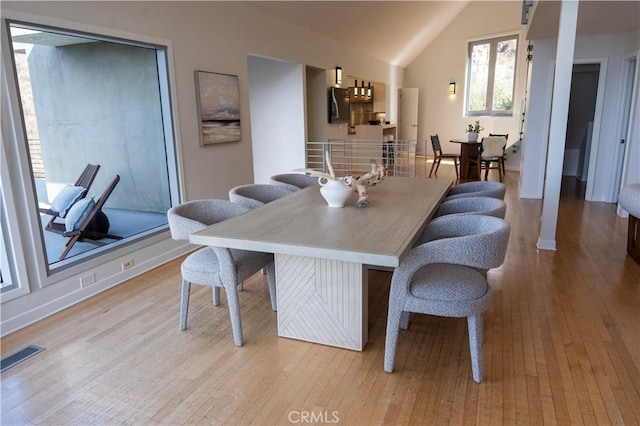 901 Summit Dr, Laguna Beach, CA 92651 - dining room featuring lofted ceiling and hardwood / wood-style flooring