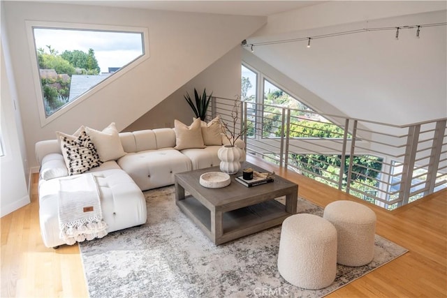 901 Summit Dr, Laguna Beach, CA 92651 - living area with wood finished floors, baseboards, and rail lighting