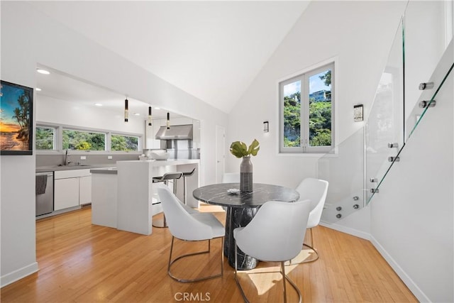 901 Summit Dr, Laguna Beach, CA 92651 - dining room with light wood-type flooring, baseboards, high vaulted ceiling, and recessed lighting
