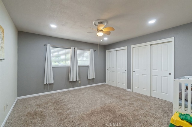 9331 E Mesa Ave, Clovis, CA 93619 - unfurnished bedroom with multiple closets, carpet floors, recessed lighting, and baseboards