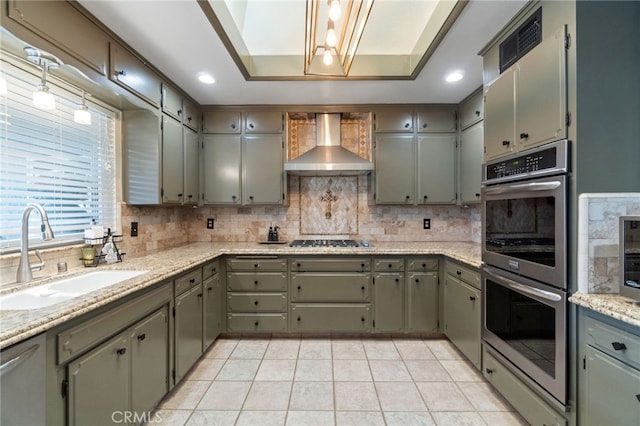 9331 E Mesa Ave, Clovis, CA 93619 - kitchen with wall chimney range hood, a sink, stainless steel appliances, tasteful backsplash, and recessed lighting