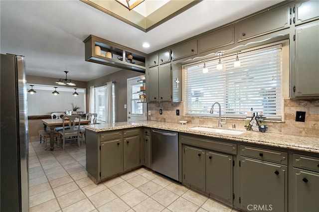 9331 E Mesa Ave, Clovis, CA 93619 - kitchen featuring appliances with stainless steel finishes, a sink, decorative backsplash, a peninsula, and light tile patterned flooring