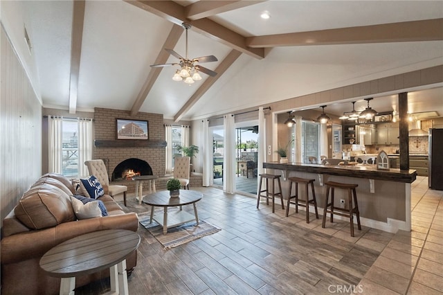 9331 E Mesa Ave, Clovis, CA 93619 - living area featuring a brick fireplace, a ceiling fan, and wood finished floors