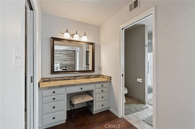 9331 E Mesa Ave, Clovis, CA 93619 - bathroom with toilet, wood finished floors, and vanity