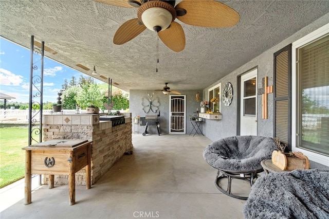 9331 E Mesa Ave, Clovis, CA 93619 - view of patio featuring ceiling fan and an outdoor kitchen