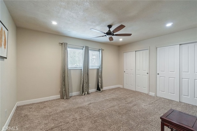 9331 E Mesa Ave, Clovis, CA 93619 - unfurnished bedroom featuring two closets, recessed lighting, carpet, baseboards, and ceiling fan