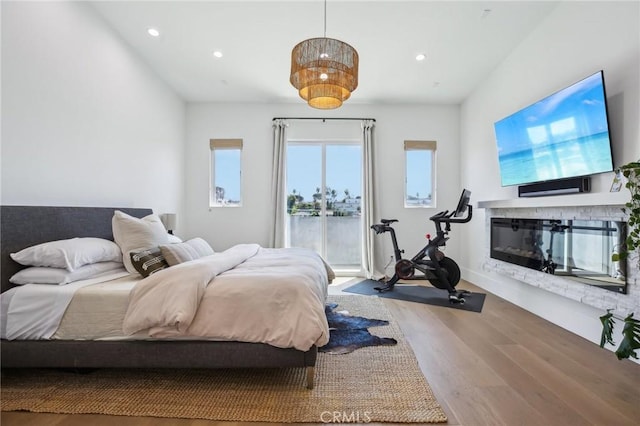 1926 Ruhland Ave Unit B, Redondo Beach, CA 90278 - bedroom featuring wood finished floors, recessed lighting, a glass covered fireplace, and access to exterior