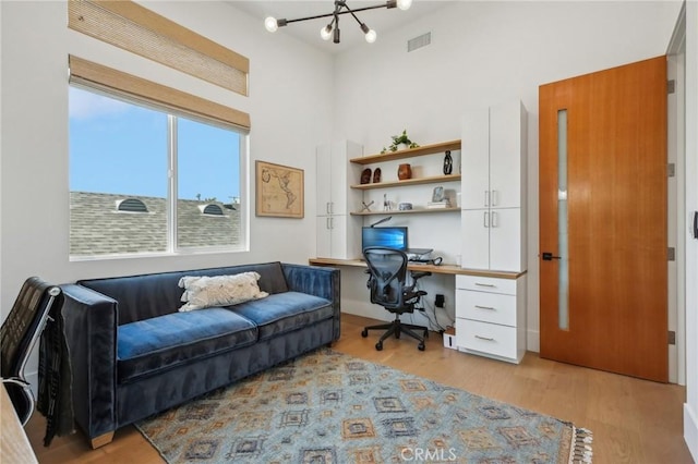 1926 Ruhland Ave Unit B, Redondo Beach, CA 90278 - office featuring a chandelier, light wood-type flooring, and a towering ceiling