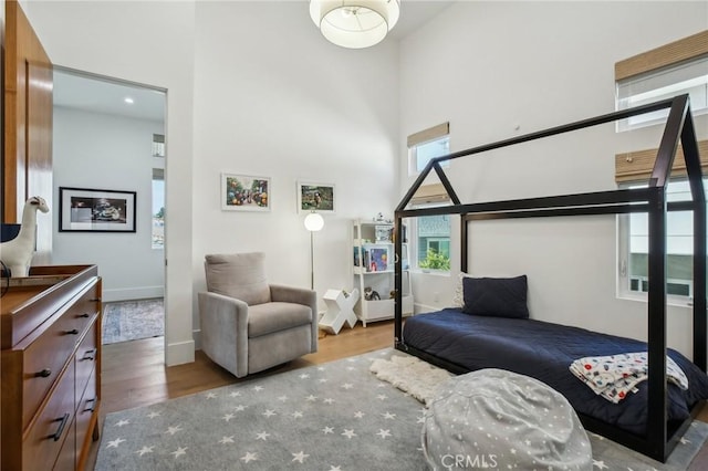 1926 Ruhland Ave Unit B, Redondo Beach, CA 90278 - bedroom featuring a high ceiling, wood finished floors, multiple windows, and baseboards