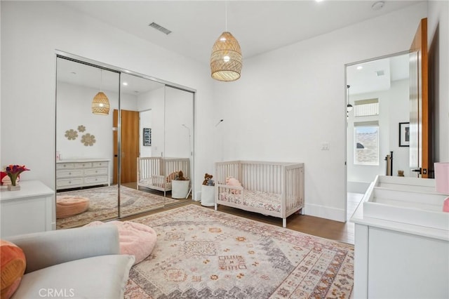 1926 Ruhland Ave Unit B, Redondo Beach, CA 90278 - bedroom with a closet, wood finished floors, recessed lighting, a crib, and baseboards