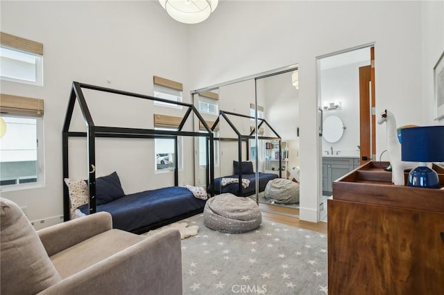 1926 Ruhland Ave Unit B, Redondo Beach, CA 90278 - bedroom with wood finished floors, a sink, and a towering ceiling