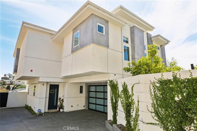 1926 Ruhland Ave Unit B, Redondo Beach, CA 90278 - view of front of property with stucco siding and a garage