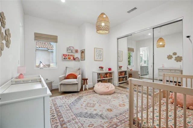 1926 Ruhland Ave Unit B, Redondo Beach, CA 90278 - bedroom with light wood-style flooring, a closet, a crib, recessed lighting, and baseboards