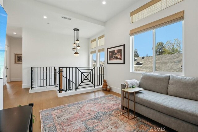 1926 Ruhland Ave Unit B, Redondo Beach, CA 90278 - sitting room featuring an upstairs landing, recessed lighting, wood finished floors, and baseboards